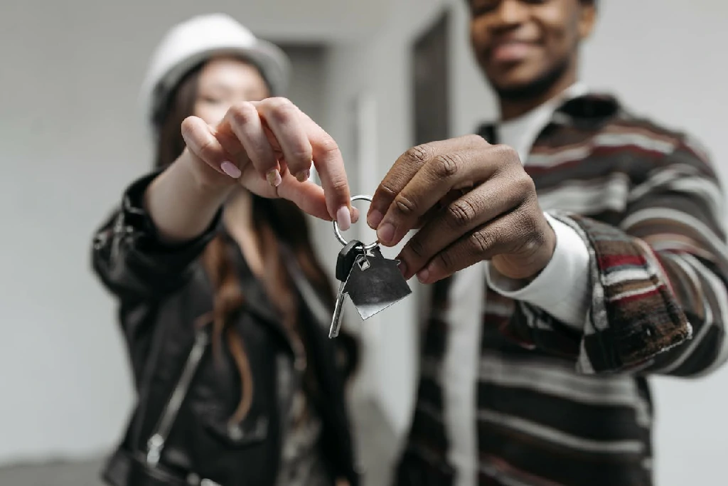Photo by Pavel Danilyuk: https://www.pexels.com/photo/a-couple-holding-their-house-key-7937959/